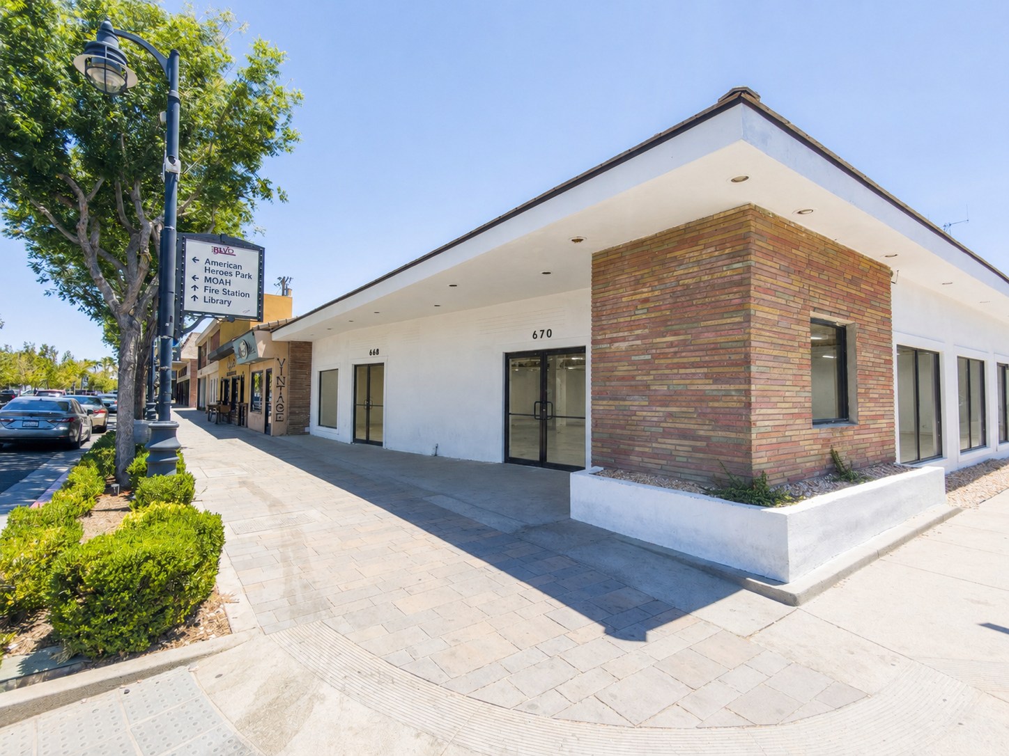 Corner exterior of 670 Lancaster Blvd with storefront windows